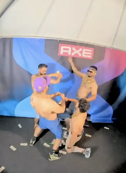 Gäste tanzen beim AXE-Event vor dem Glambot